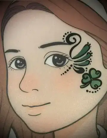 Butterfly face painting design with glitter accents for kids birthday parties.