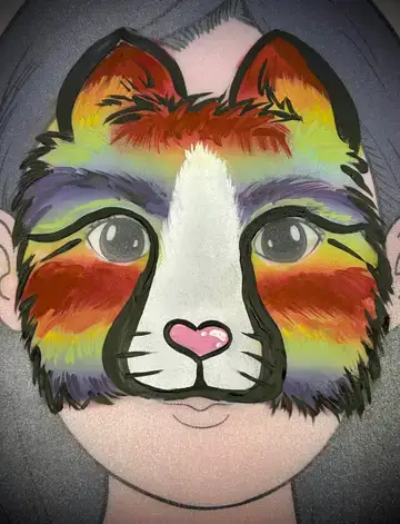 Cat face painting design with bold orange details for children's parties.